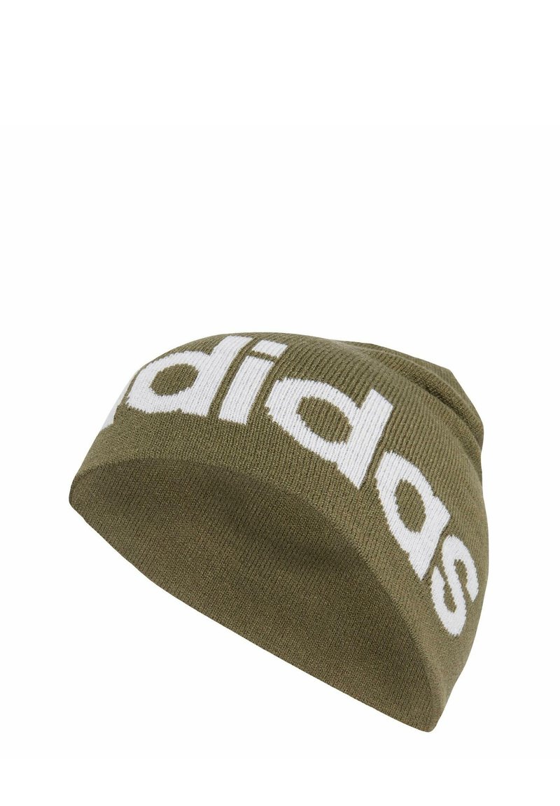 Green knitted beanie made from soft fabric, featuring a large white "adidas" logo in a bold, modern font.