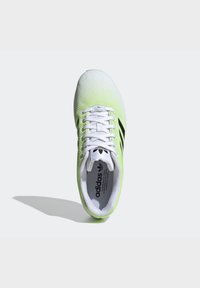 Lime green and white mesh athletic shoe with black stripes, round toe, white laces, and cushioned interior. Features brand logo on tongue.