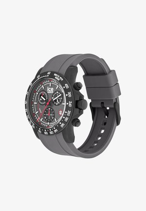 Sort og gråt chronograph armbåndsur med tachymeter ramme, tre underskiver, datovindue og silikonerem med spænde.
