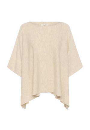 Haut oversize beige clair en tissu doux et texturé avec un large col et des manches courtes et fluides. Présente un ourlet asymétrique.