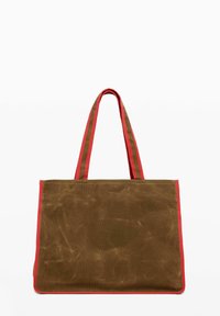 Canvas tote bag in brown with red accents. Features two long handles and a rectangular shape with a textured surface.