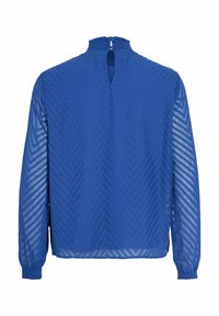 Blusa blu a maniche lunghe con colletto alto, caratterizzata da un dettaglio a occhio di chiave sulla schiena e da un motivo a zigzag su tessuto trasparente.