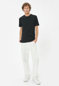 Koton SLIM FIT  - T-shirts basic - black