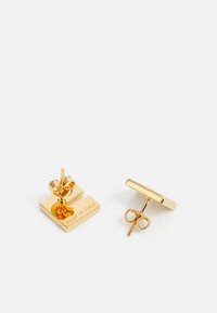 Gold-tone metal earrings with a square shape and polished finish. Features "MADE IN ITALY" engraving and a secure post-back design.
