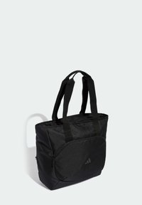 Czarna torba typu tote wykonana z trwałej tkaniny, wyposażona w dwa solidne górne uchwyty, zapinaną na zamek kieszeń z przodu oraz subtelny detal z logo.