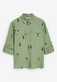 Green short-sleeve shirt with a button-up front. Features embroidered potted plants and subtle polka dot pattern. Two chest pockets.