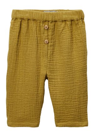 Shorts de couleur moutarde en tissu texturé. Dotés d'une taille élastique et de deux boutons en bois à l'avant.