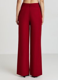 Calliope PALAZZO - Pantaloni - rosso scuro