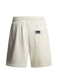 Μπεζ σορτς με ελαστική μέση και πίσω τσέπη που φέρει ένα μικρό σήμα λογότυπου Bluebull Racing σε σκούρο μπλε χρώμα.