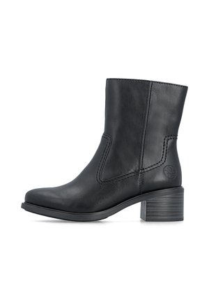 Bottine en cuir noir avec talon bloc et coutures décoratives, vue de profil sur fond blanc.