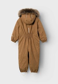 Brown insulated jumpsuit with a hood, faux fur trim, elastic waist, and reflective accents. Features elastic cuffs and foot straps.