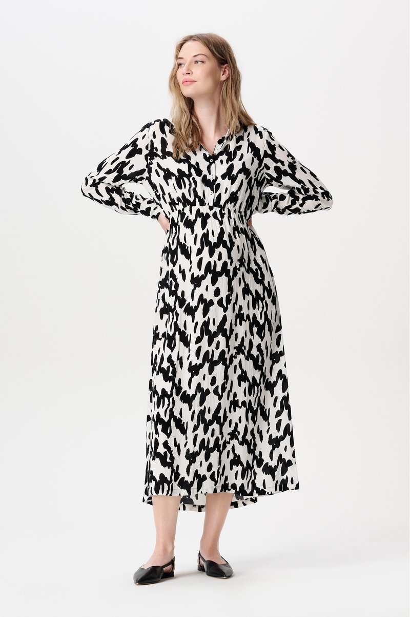 Zwart-wit gestreepte maxi-jurk, met een knoopsluiting aan de voorkant, lange mouwen en een cinched taille. Glad stof met een vloeiende vorm.