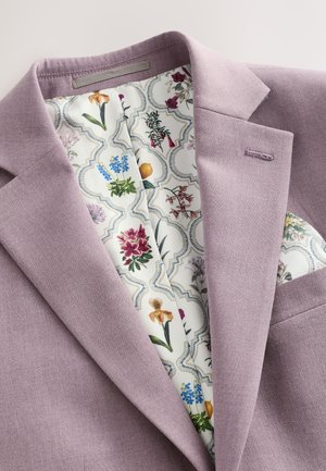 Tailored lilac blazer featuring a floral-patterned lining in cream, with intricate designs in purple, blue, and green. Single chest pocket.