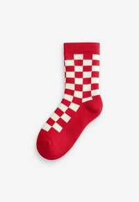 Rot- und cremefarbener Socken aus Baumwolle im Schachbrettmuster mit geripptem Bündchen, der eine glatte Textur und ein abgerundetes Zehendesign aufweist.
