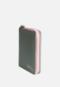 Green leather wallet with pink and gray zippers. Features a sleek design, compact shape, and a logo printed on the front.