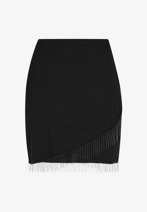 Black mini skirt with a fitted design, featuring a diagonal fringe detail along the hem made of metallic accents. Smooth texture.