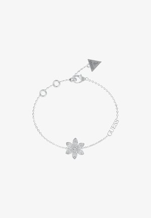 Silver bracelet featuring a floral-shaped charm encrusted with clear stones, with a textured chain and a logo tag.