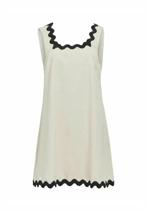 Rochie fără mâneci din material crem, având un decolteu și un tiv negru cu margini ondulate. Design simplu, formă evazată și textură netedă.