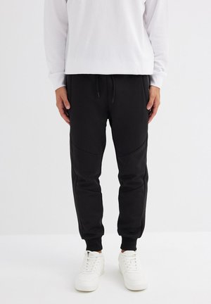 INSIDE JOGGER - Pantalones deportivos - black