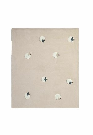 Beige square rug with eight small white sheep patterns, each with brown faces, scattered evenly across the surface.