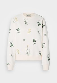 Lys beige genser med blomsterbroderi i forskjellige grønne og pastellfarger. Har rund hals og ribbestrikkede mansjetter. Mykt stoff.