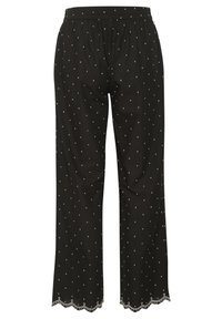 Svarta byxor med lös passform, prydda med ett mönster av vita prickar, en elastisk midja och scallop-lace detaljer vid nederkanten.