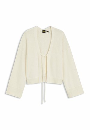 Cream-colored knit cardigan with long wide sleeves, open front, and two ties hanging down the center.