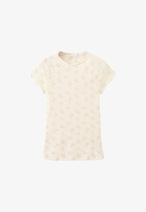 T-shirt en maille côtelée crème à manches courtes avec un motif floral subtil et un col rond.