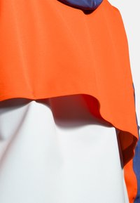 Brooks HIGH POINT  - Vandeniui atspari striukė - lt slate bright orange aegean