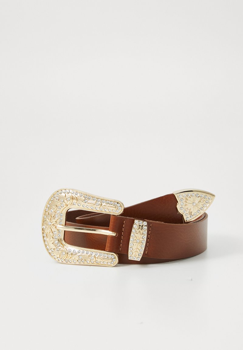 Brown leather belt with a large, ornate gold buckle featuring intricate designs and rhinestone accents. Decorative ends with pointed tips.