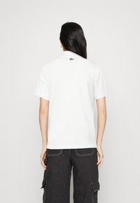 Lacoste LACOSTE X NETFLIX - Polo - white