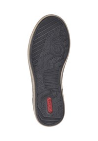 Suela de zapato de goma negra con patrón de textura; presenta un logotipo rojo y marcas de tamaño. El borde es beige, contrastando con el material más oscuro.