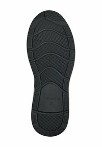 Suola di scarpa in gomma nera con un motivo testurizzato caratterizzato da scanalature e accenti circolari, etichettata con il marchio "Tamaris" e la taglia "37."
