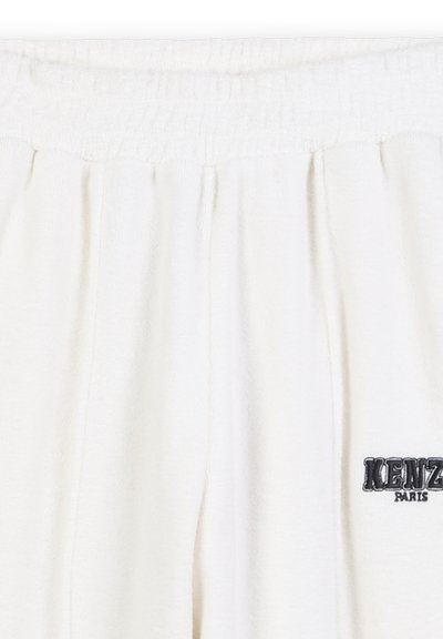 Pantalon de jogging blanc avec une taille froncée et le logo KENZO Paris brodé en noir sur le bas à droite.