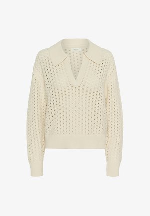 Pull tricoté de couleur crème, avec un col en V et un col, présentant un tissage ouvert ainsi que des poignets et un ourlet côtelés. Les détails comprennent des motifs triangulaires.