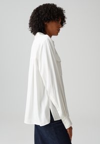 OPUS LANGARMBLUSE FLARA - Camicia - milk