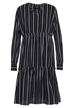 Robe noire à manches longues avec rayures verticales blanches, taille élastique, manches avec poignets et ourlet à volants superposés.