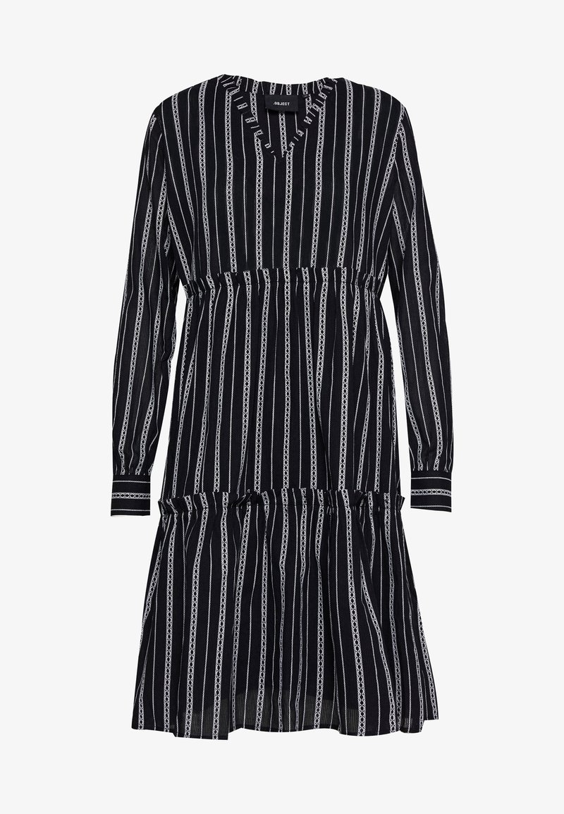 Robe noire à manches longues avec rayures verticales blanches, taille élastique, manches avec poignets et ourlet à volants superposés.
