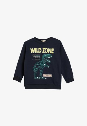 Felpa blu navy con polsini e orlo a coste. Presenta una grafica geometrica di un dinosauro e il testo "WILD ZONE" in giallo chiaro.