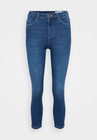 Jeans skinny de algodón en azul medio. Presentan un diseño clásico de cinco bolsillos con cierre de cremallera y botón. Textura suave, ajuste ceñido.