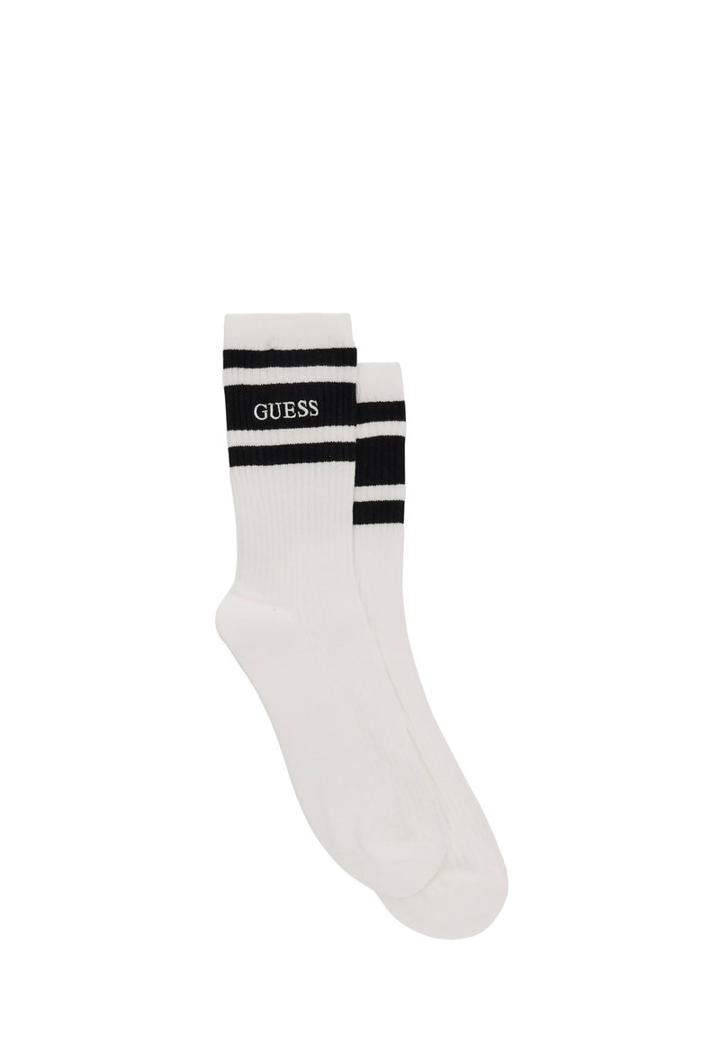White cotton socks featuring two black stripes at the top and "GUESS" logo in black. Smooth texture, standard crew length design.