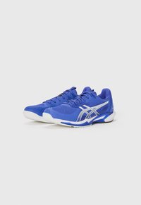 Blue athletic shoes made of synthetic material with a textured upper, featuring silver accents and a white traction outsole, designed for performance.