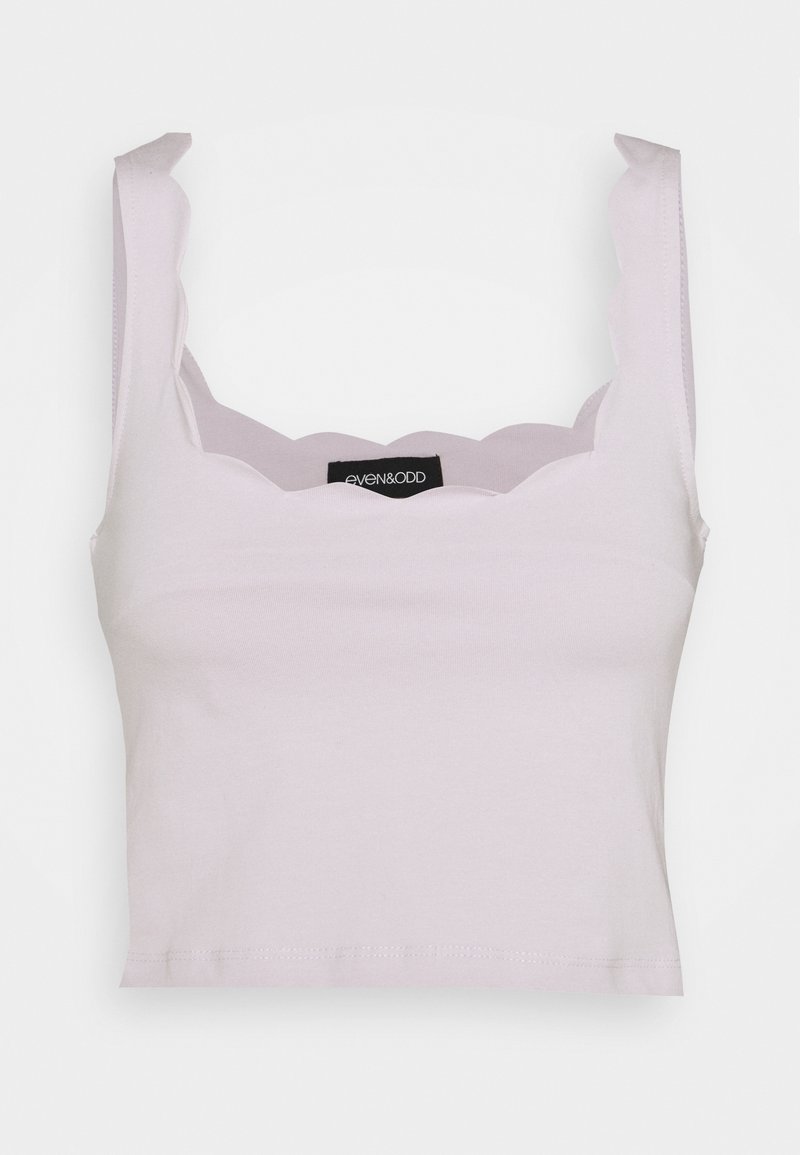 Lavender cropped tank top with scalloped neckline and thick straps. Made of soft material with a smooth texture. Brand label visible.