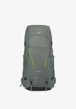 Sac à dos de randonnée gris Osprey Kyte 68 avec plusieurs sangles, boucles et lignes d'accent jaunes sur le panneau avant.