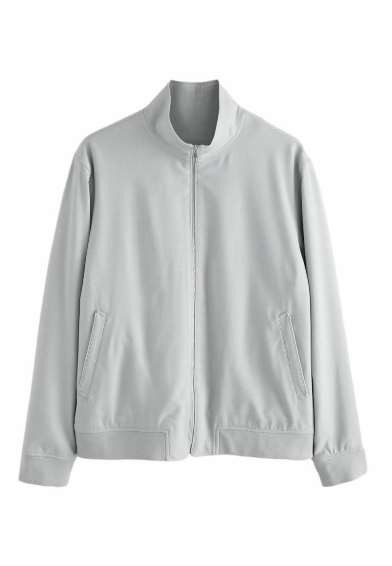 Light gray zip-up jacket with stand collar, long sleeves, side pockets, and ribbed cuffs and hem, displayed on plain white background.