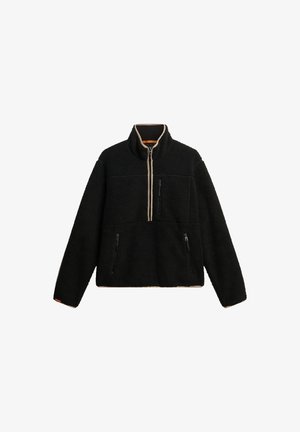 Zwarte fleece pullover met een halve rits aan de voorkant, hoge kraag en twee ritszakken aan de zijkant. Beschikt over een gestructureerd oppervlak en een contrasterende rits.
