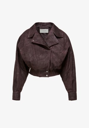 Leikattu tummanruskea keinonahkainen takki leveillä kauluksilla, napilliset läpät kauluksessa ja edessä, joustava helma ja pitkät hihat, joissa napilliset kalvosimet.