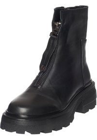 Bottine en cuir noire avec semelle épaisse à relief et fermeture éclair à l'avant avec languette de traction.