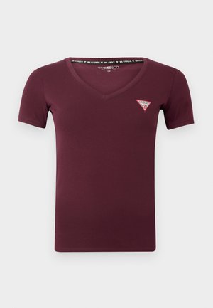 Bordo trumpomis rankovėmis V-kaklo marškiniai, pagaminti iš lygios medžiagos, su mažo raudono ir balto trikampio logotipu kairėje krūtinės pusėje.