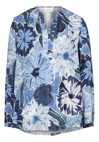 Blouse à manches longues avec grand motif floral bleu et blanc, col en V fendu, coupe décontractée.